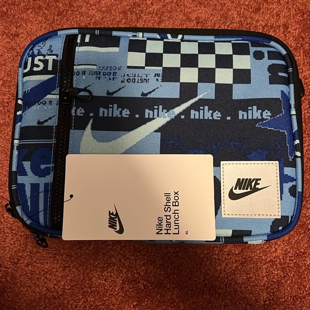 Nike Just Do It hardshell lunchbox in university blue and white.